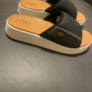 Hey Dude Women's Black and Tan Slide Sandals